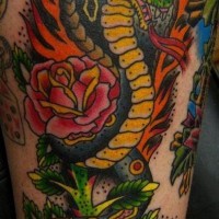 Flaming cobra snake with roses tattoo
