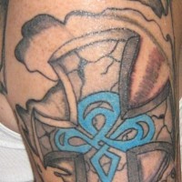 Celtic style cross sleeve tattoo
