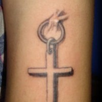 Cross piercing tattoo