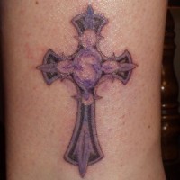 Purple cross with tracery tattoo