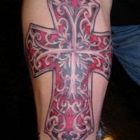 Cross tattoo with red pattern