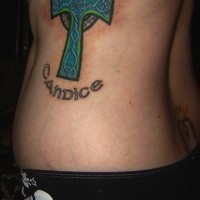 Celtic style cross tattoo on side