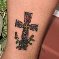 Coloured cross with flowers tattoo