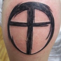 Minimalistic black cross in circle tattoo
