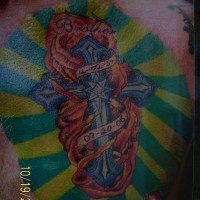 Large coloured cross in flame memorial tattoo