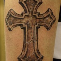 Realistic stone cross tattoo