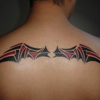 Black & red  wings tattoo in an interesting style