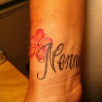 Calligraphic name with flower inner wrist tattoo