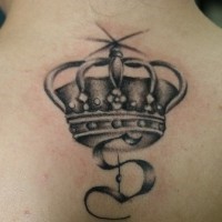 Crowned monogram black ink tattoo