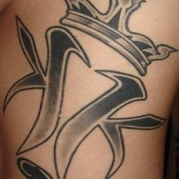 Crowned tribal black ink tattoo
