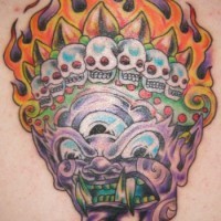 Three eyed demon with crown of skulls tattoo