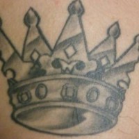 Golden crown black ink tattoo