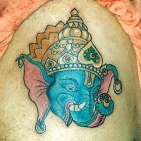Ganesha in golden crown tattoo