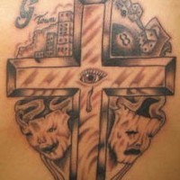 Crowned cross with theatrical masks tattoo