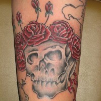 Skull with crown of roses tattoo