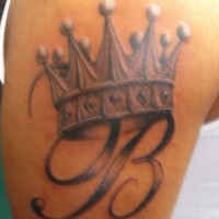 Crowned monogram tattoo