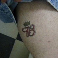 Budweiser crown tattoo on leg