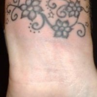Daisy tattoo on wrist