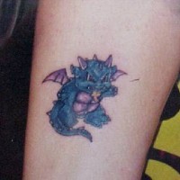 Blue angry little dragon tattoo
