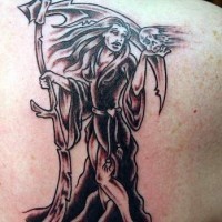 She-death tattoo on shoulder