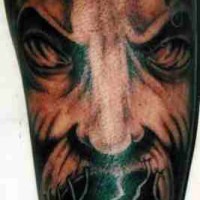 demone pieno sul braccio tatuaggio