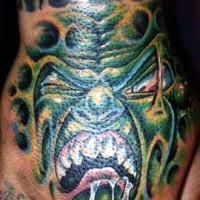 Ugly green creature artwork tattoo