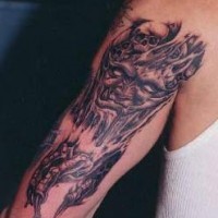 Death themed arm tattoo