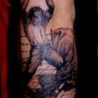 Man slaying demon tattoo