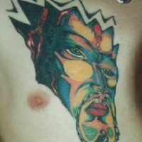 Surreal demon face coloured tattoo