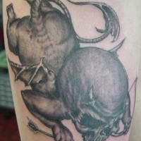 Creepy black demon cherub tattoo