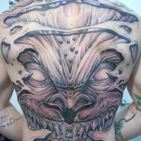 Sharp toothed devil full back tattoo