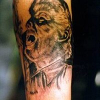 Demon creature tattoo on hand