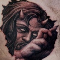 Horned devil under skin tattoo