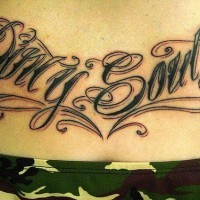 Tattoo on lower back, dirty south, styled  inscription