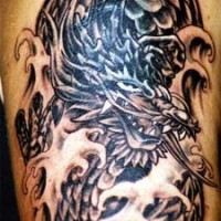 Black dragon in sea storm tattoo