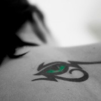 Green eye of horus tribal tattoo