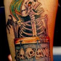 Laughing skeleton with drums tattoo