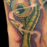 Le tatouage d’œil vert démoniaque