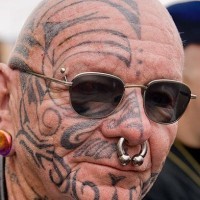 Different figures face tattoo