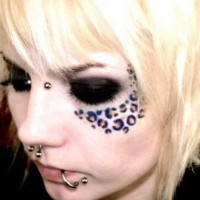 Leopard style  face tattoo