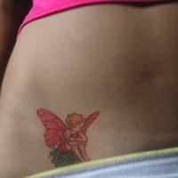 Colourful fairy tattoo on lower tummy