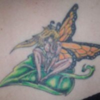 Sexy fairy on leaf coloured tattoo