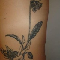 Black and white little fairy under flower tattoo