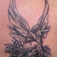 Forest fairy on flower tattoo