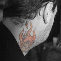 Rose in fire tattoo on neck
