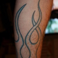 Fire silhouette leg tattoo