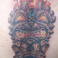 Wooden deity in flame coloured tattoo