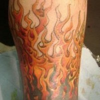 Classic flames tattoo on leg