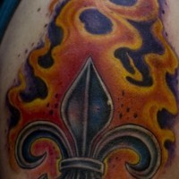 Fleur de lis symbol in flame tattoo