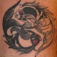 Black & white yin yang tattoo with fishes